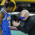 UCLA coach Mick Cronin, right, talks with guard David Singleton during the second half of the team's NCAA college basketball game against Arizona State on Thursday, Jan. 7, 2021, in Tempe, Ariz. UCLA won 81-75 in overtime. (AP Photo/Ross D. Franklin)