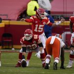 Kansas City Chiefs quarterback Patrick Mahomes (15) signals teammates at the line of scrimmage during the second half of an NFL divisional round football game against the Cleveland Browns, Sunday, Jan. 17, 2021, in Kansas City. (AP Photo/Jeff Roberson)