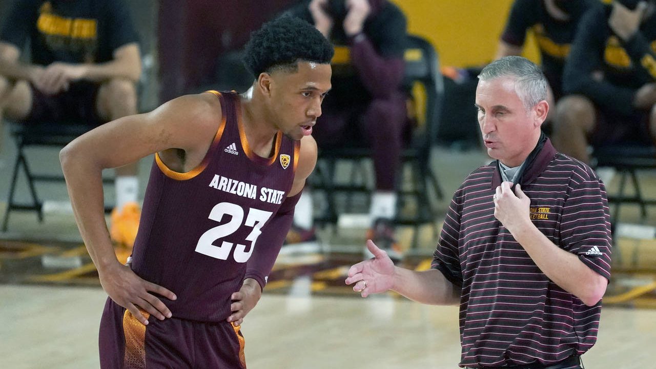 Arizona State coach Bobby Hurley talks to Marcus Bagley during the first half of the team's NCAA co...