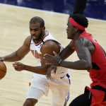 Phoenix Suns guard Chris Paul, left, gets fouled by Toronto Raptors forward Pascal Siakam, right, during the second half of an NBA basketball game Wednesday, Jan. 6, 2021, in Phoenix. The Suns defeated the Raptors 123-115. (AP Photo/Ross D. Franklin)