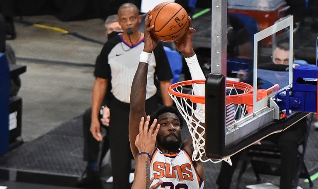 Deandre Ayton #22 of the Phoenix Suns attempts a dunk against Xavier Tillman #2 of the Memphis Griz...