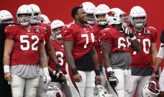 Offensive tackle D.J. Humphries #74 of the Arizona Cardinals stands with teammates during the Red &...