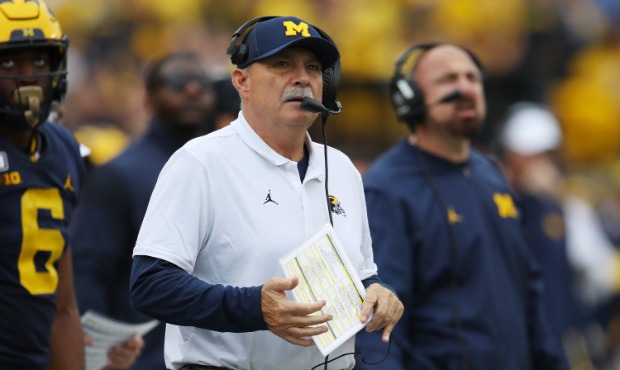 Defensive coordinator Don Brown of the Michigan Wolverines look on during the second half while pla...