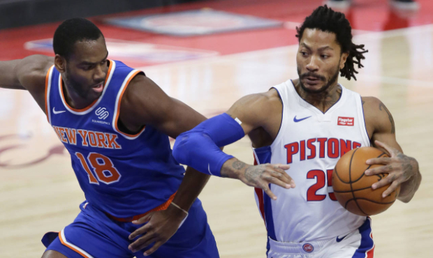 Detroit Pistons guard Derrick Rose (25) drives to the basket against New York Knicks guard Alec Bur...