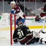 Colorado Avalanche right wing Mikko Rantanen (96) scores a goal Arizona Coyotes goaltender Adin Hill (31) during the second period of an NHL hockey game Friday, Feb. 26, 2021, in Glendale, Ariz. (AP Photo/Ross D. Franklin)