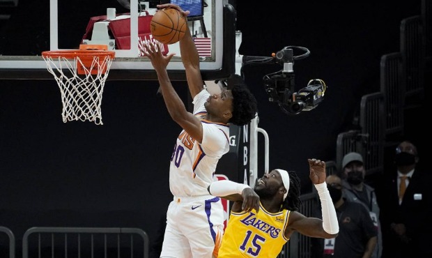 Phoenix Suns center Damian Jones (30) reaches for a pass as Los Angeles Lakers forward Montrezl Har...