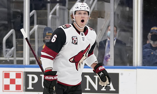 Arizona Coyotes' Jakob Chychrun celebrates after scoring during the first period of an NHL hockey g...