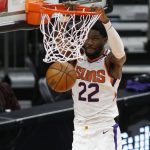 Phoenix Suns' Deandre Ayton slams one home against the Portland Trail Blazers during the first half of an NBA basketball game Monday, Feb. 22, 2021, in Phoenix. (AP Photo/Darryl Webb)