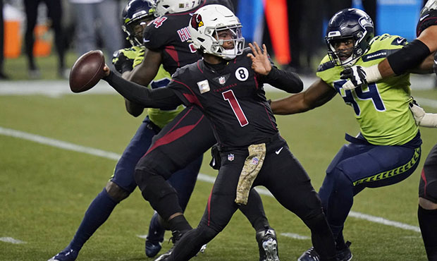 Arizona Cardinals quarterback Kyler Murray (1) passes under pressure from Seattle Seahawks' Rasheem...