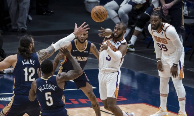 Phoenix Suns guard Chris Paul (3) passes the ball as New Orleans Pelicans center Steven Adams (12) ...