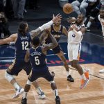 Phoenix Suns guard Chris Paul (3) passes the ball as New Orleans Pelicans center Steven Adams (12) and guard Eric Bledsoe (5) defend during the second quarter of an NBA basketball game in New Orleans, Wednesday, Feb. 3, 2021. (AP Photo/Derick Hingle)