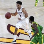 Arizona State guard Remy Martin (1) moves the ball upcourt against Oregon during the second half of an NCAA college basketball basketball game, Thursday, Feb. 11, 2021, in Tempe, Ariz. (AP Photo/Matt York)