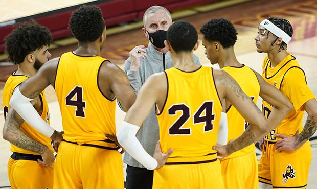 Arizona State head coach Bobby Hurley talks with his team during the first half of an NCAA College ...
