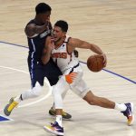 Dallas Mavericks guard Josh Richardson (0) defends against Phoenix Suns guard Devin Booker (1) in the first half during an NBA basketball game, Monday, Feb. 1, 2021, in Dallas. (AP Photo/Richard W. Rodriguez)