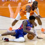 Detroit Pistons guard Delon Wright (55) chases down the ball as Phoenix Suns guard Chris Paul defends during the first half of an NBA basketball game Friday, Feb. 5, 2021, in Phoenix. (AP Photo/Matt York)