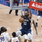 New Orleans Pelicans center Steven Adams (12) dunks over Phoenix Suns forward Mikal Bridges (25) and forward Jae Crowder (99) in the first quarter of an NBA basketball game in New Orleans, Wednesday, Feb. 3, 2021. (AP Photo/Derick Hingle)