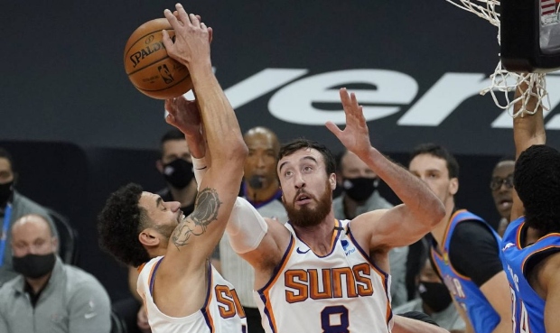 Phoenix Suns forward Frank Kaminsky (8) and forward Abdel Nader battle for a rebound against the Ok...