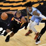 Phoenix Suns guard Chris Paul (3) drives against Memphis Grizzlies guard Ja Morant in the first half of an NBA basketball game Saturday, Feb. 20, 2021, in Memphis, Tenn. (AP Photo/Brandon Dill)