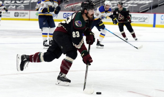 Arizona Coyotes right wing Conor Garland (83) drives toward the net against the St. Louis Blues in ...