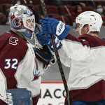 Colorado Avalanche goaltender Hunter Miska (32) celebrates with defenseman Devon Toews, right, as time expires in the team's 3-2 win over the Arizona Coyotes in an NHL hockey game Friday, Feb. 26, 2021, in Glendale, Ariz. (AP Photo/Ross D. Franklin)