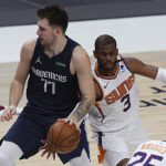 Dallas Mavericks guard Luka Doncic (77) has the ball tipped away by Phoenix Suns guard Chris Paul (3) in the second half during an NBA basketball game, Monday, Feb. 1, 2021, in Dallas. (AP Photo/ Richard W. Rodriguez)