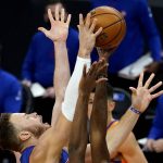 Detroit Pistons forward Blake Griffin, left, battles for a rebound during the first half of an NBA basketball game against the Phoenix Suns, Friday, Feb. 5, 2021, in Phoenix. (AP Photo/Matt York)
