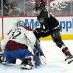 Colorado Avalanche goaltender Hunter Miska, left, stops a last-second shot by Arizona Coyotes defenseman Jakob Chychrun (6) during an NHL hockey game Friday, Feb. 26, 2021, in Glendale, Ariz. The Avalanche won 3-2. (AP Photo/Ross D. Franklin)