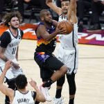 Phoenix Suns guard Chris Paul (3) shoots as Brooklyn Nets guard Tyler Johnson (10) watches during the second half of an NBA basketball game Tuesday, Feb. 16, 2021, in Phoenix. (AP Photo/Matt York)