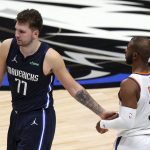 Dallas Mavericks guard Luka Doncic (77) shakes hands with Phoenix Suns guard Chris Paul (3) as he walks off the court after the Mavericks loss in an NBA basketball game, Monday, Feb. 1, 2021, in Dallas. (AP Photo/Richard W. Rodriguez)