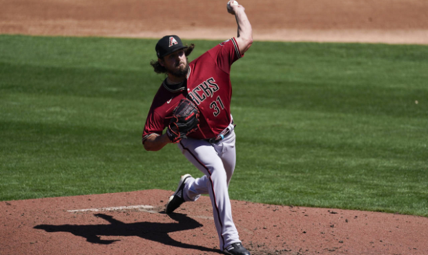 Arizona Diamondbacks starting pitcher Caleb Smith (31) throws during the first inning of a spring t...