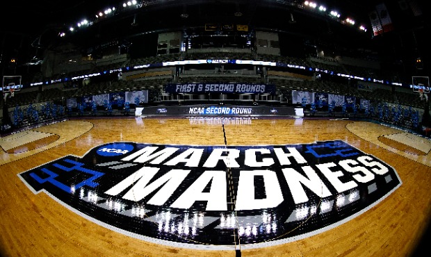 A general view of the March Madness logo on center court is seen before the game between the Oral R...