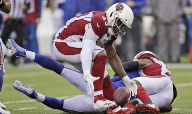Arizona Cardinals' Haason Reddick recovers a fumble forced by teammate Patrick Peterson during the ...