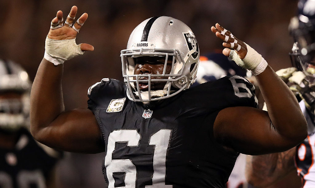 Rodney Hudson #61 of the Oakland Raiders celebrates after a touchdown against the Denver Broncos at...