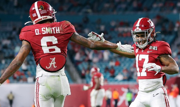 DeVonta Smith #6 of the Alabama Crimson Tide celebrates his touchdown with Jaylen Waddle #17 during...