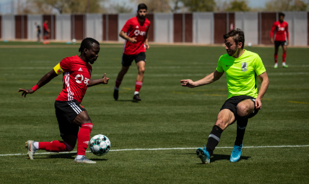 Phoenix Rising FC captain Solomon Asante takes a Union Omaha defender in a preseason friendly on Ma...
