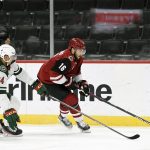 Arizona Coyotes' Derick Brassard (16) skates with the puck against Minnesota Wild's Matt Dumba (24) during the second period of an NHL hockey game Tuesday, March 16, 2021, in St. Paul, Minn. (AP Photo/Hannah Foslien)