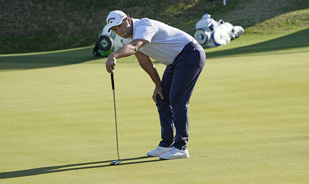 Jon Rahm, of Spain, stares at the ball when his birdie putt stopped short of the hole on the No. 17...
