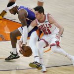 Chicago Bulls guard Ryan Arcidiacono (51) strips the ball from Phoenix Suns forward Torrey Craig during the second half of an NBA basketball game Wednesday, March 31, 2021, in Phoenix. (AP Photo/Ross D. Franklin)