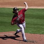 Arizona Diamondbacks starting pitcher Caleb Smith (31) throws during the first inning of a spring training baseball game against the Milwaukee Brewers Friday, March 19, 2021, in Phoenix. (AP Photo/Ashley Landis)