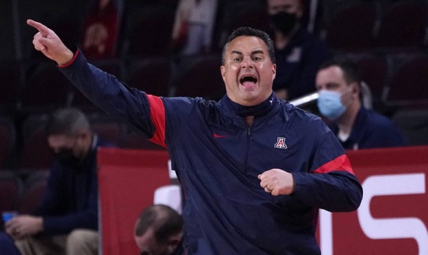Arizona head coach Sean Miller instructs from the bench during the first half of an NCAA college ba...