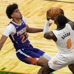 
              Orlando Magic guard Dwayne Bacon (8) is fouled as Phoenix Suns forward Cameron Johnson (23) blocks his path to the basket during the second half of an NBA basketball game, Wednesday, March 24, 2021, in Orlando, Fla. (AP Photo/John Raoux)
            