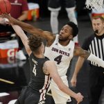 Arizona State's Kimani Lawrence, right, blocks a shot by Washington State's Aljaz Kunc during the second half of an NCAA college basketball game in the first round of the Pac-12 men's tournament Wednesday, March 10, 2021, in Las Vegas. (AP Photo/John Locher)