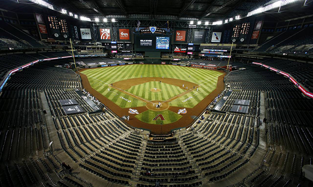 The Arizona Diamondbacks and the Los Angeles Dodgers play in an empty Chase Field during the fourth...