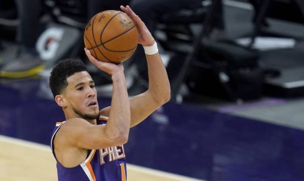 Phoenix Suns guard Devin Booker (1) shoots over Chicago Bulls forward Patrick Williams (44) during ...