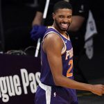 Phoenix Suns forward Mikal Bridges smiles after scoring and drawing a foul during the second half of an NBA basketball game against the Los Angeles Lakers Tuesday, March 2, 2021, in Los Angeles. (AP Photo/Mark J. Terrill)