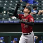 Arizona Diamondbacks' Pavin Smith gestures as he runs towards home plate after hitting a home run in the second inning of a spring training baseball game against the Kansas City Royals, Thursday, March 25, 2021, in Surprise, Ariz. (AP Photo/Sue Ogrocki)