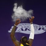 Los Angeles Lakers forward LeBron James tosses powder in the air prior to an NBA basketball game against the Phoenix Suns Tuesday, March 2, 2021, in Los Angeles. (AP Photo/Mark J. Terrill)