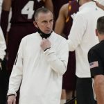 
              Arizona State head coach Bobby Hurley speaks with an official during the first half of an NCAA college basketball game against Oregon in the quarterfinal round of the Pac-12 men's tournament Thursday, March 11, 2021, in Las Vegas. (AP Photo/John Locher)
            
