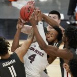 Washington State's DJ Rodman (11), and Efe Abogidi, right, vie for a rebound with Arizona State's Kimani Lawrence (4) during the first half of an NCAA college basketball game in the first round of the Pac-12 men's tournament Wednesday, March 10, 2021, in Las Vegas. (AP Photo/John Locher)