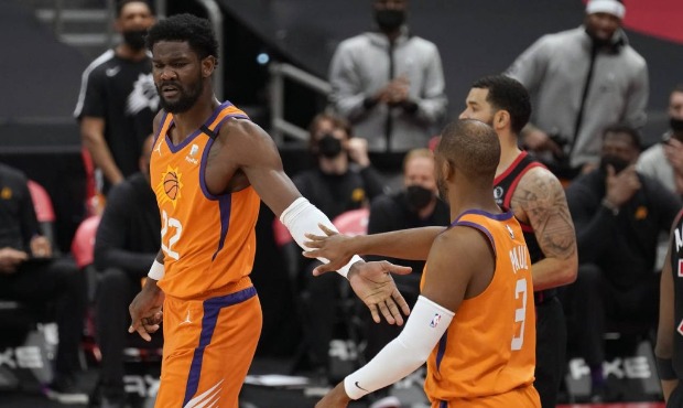 Phoenix Suns center Deandre Ayton (22) celebrates with guard Chris Paul (3) after making a basket a...